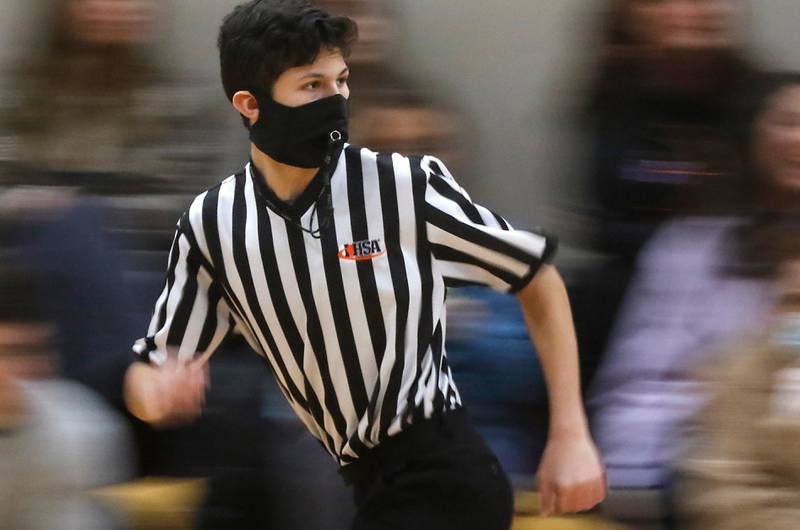 Austin Scheiblein, a Huntley High School senior, runs the court during a freshman basketball game Saturday, Feb. 5, 2022, at Marengo High School. Ottawa City Recreation is planning a free referee camp to encourage young men and women to taking up the whistle.
