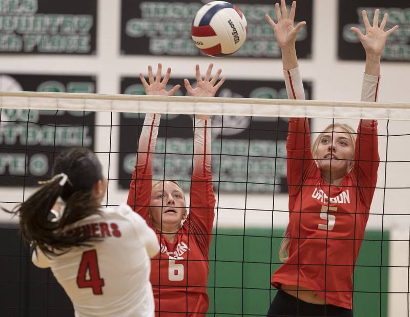 Oregon’s Emma Eckerd (left) and Skylar Bishop go up for a block against Erie-Prophetstown Tuesday, Oct. 28, 2025, in the Class 2A regional semifinal at Rock Falls.