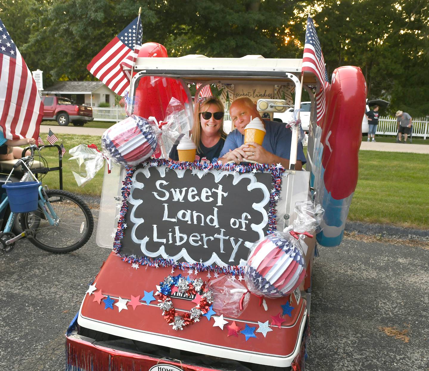 Mark and Linda Downey decorated their golf cart as the "Sweet Land of Liberty" for the Grand Detour Golf Cart Parade on July 3.