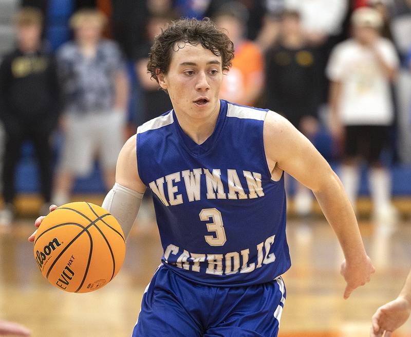 Newman’s Garret Matznick handles the ball against Eastland Tuesday, Dec. 10, 2024, at Eastland High School.