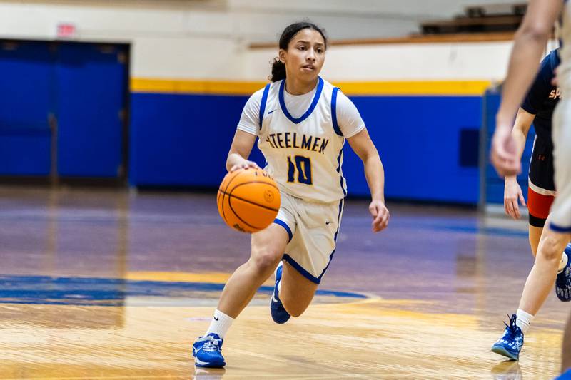 Joliet Central's Elena Moody drives towards the basket during a varsity girls basketball game against Romeoville at Joliet Central on Dec. 18, 2025.