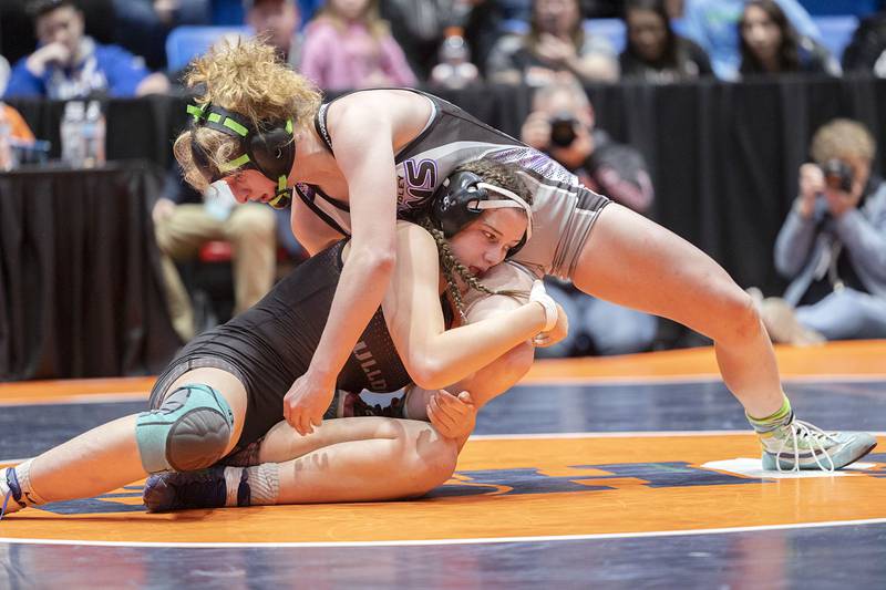 Sydney Perry of Batavia grabs the leg of Valerie Hamilton of El Paso-Gridley in the 145 pound championship match at the IHSA girls state wrestling championships Saturday, Feb. 25, 2023.