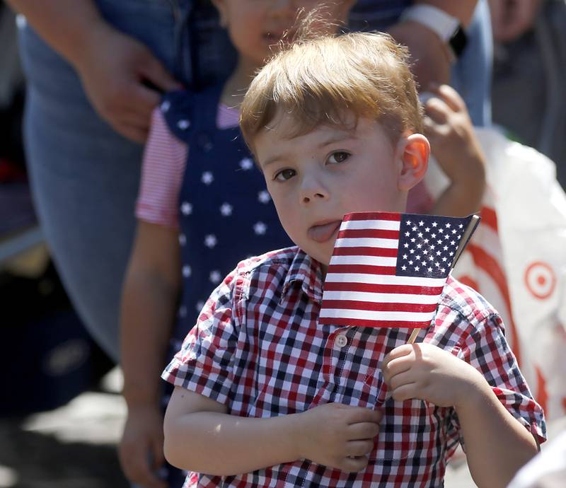 Ashton Biemena, 3, of Marengo, waits for the parade to start during the Woodstock VFW Post 5040 City Square Memorial Day Ceremony and Parade on Monday, May 29, 2023, in Woodstock.