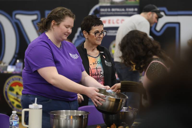 State Sen. Natalie Manly, District 98, greets guest at her table during the Will County’s annual Kids Fair at Troy Middle School on Monday, Feb. 16, 2026 in Joliet.