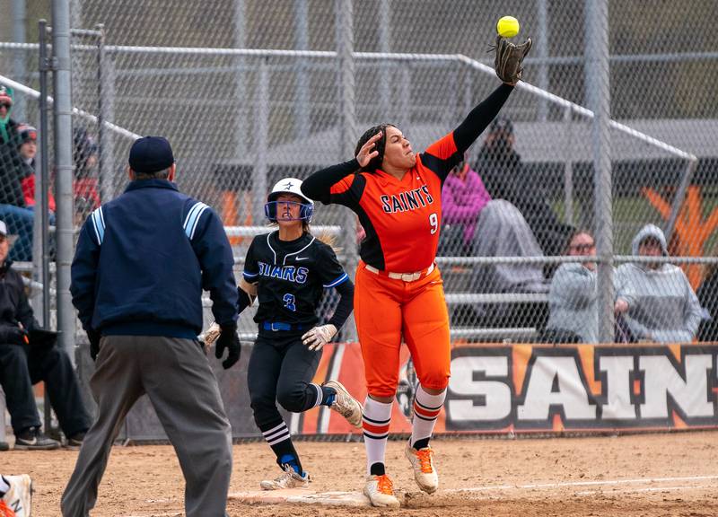 St. Charles North's Leigh VandeHei (3) beats the throw to first during a softball game against St. Charles East at St. Charles East High School on Monday, April 25, 2022.