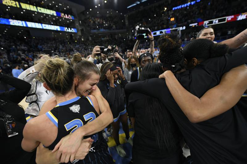 Chicago Sky's Courtney Vandersloot and Allie Quigley celebrate with teammates after defeating the Phoenix Mercury in Game 4 of the WNBA Finals 80-74 to become the WNBA Champions. Sunday, Oct. 17, 2021, in Chicago.