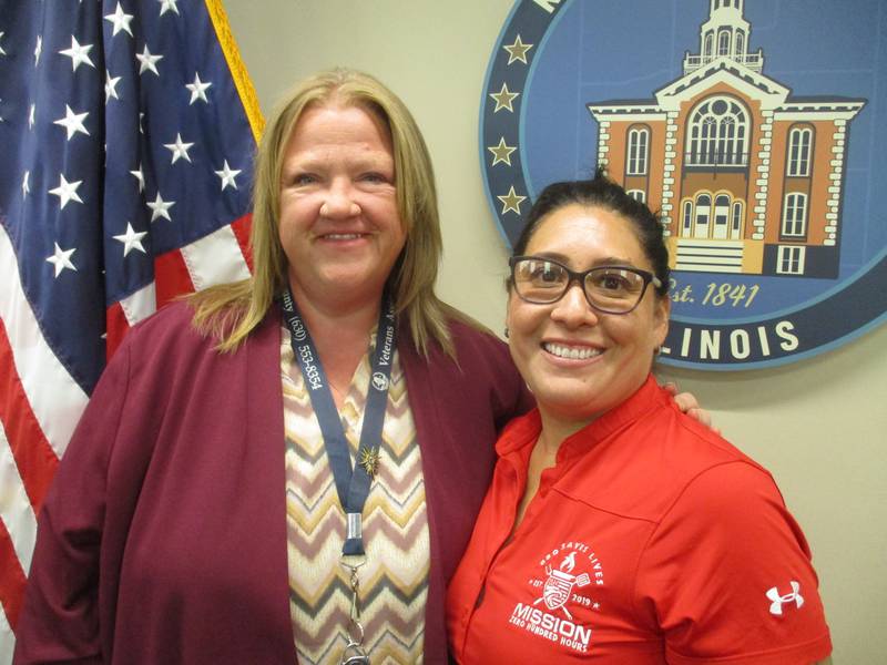 Amanda Herrera of Oswego, right, is promoting the Saluting with Smoke festival  Sept. 15 to 17 in Yorkville to benefit veterans. She is seen here on Aug. 15, 2023 with Veterans Assistance Commission of Kendall County Assistant Supervisor Karylin Clevenger.
