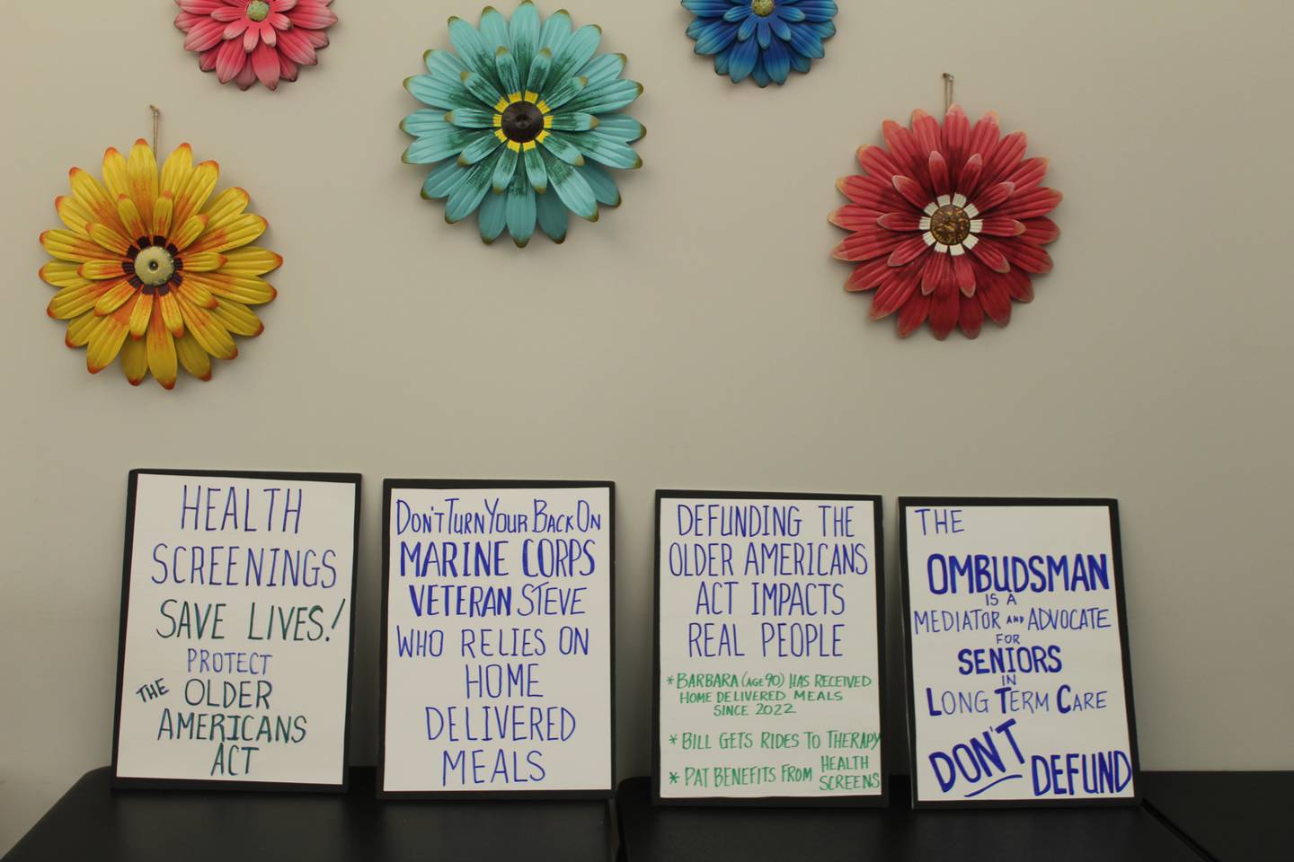 Senior Services Associates writes how the Older Americans Act affects their clients on posters.