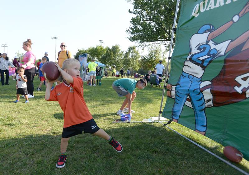 Children including Willie Sosnov of Elmhurst enjoy the games while attending Park Palooza at Berens Park Saturday Aug 19, 2023.