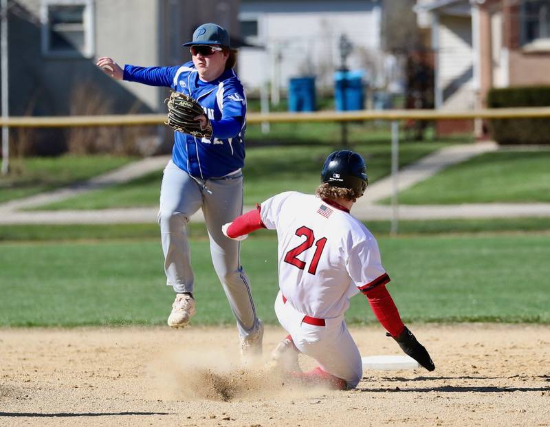 Princeton's Jordan Reinhardt tries to field the throw to second as Hall's Mac Resetich slides in safely for a stolen base in Thursday's game at Kirby Park. Hall won 10-1.