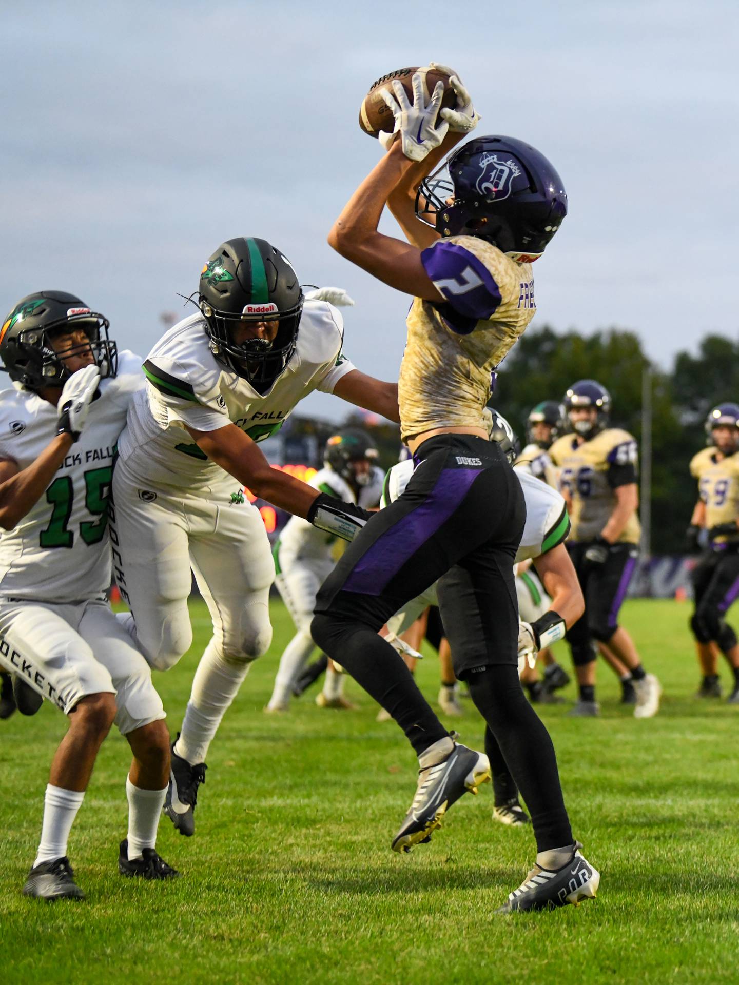 Dixon’s Cullen Shaner catches a pass for a touchdown during the first half of the varsity game at Rock Falls on Friday, Sept. 8, 2023.