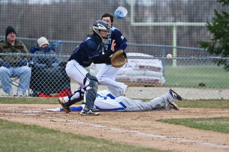 Bureau Valley catcher Sam Wright takes the throw at the plate Tuesday against Newman.