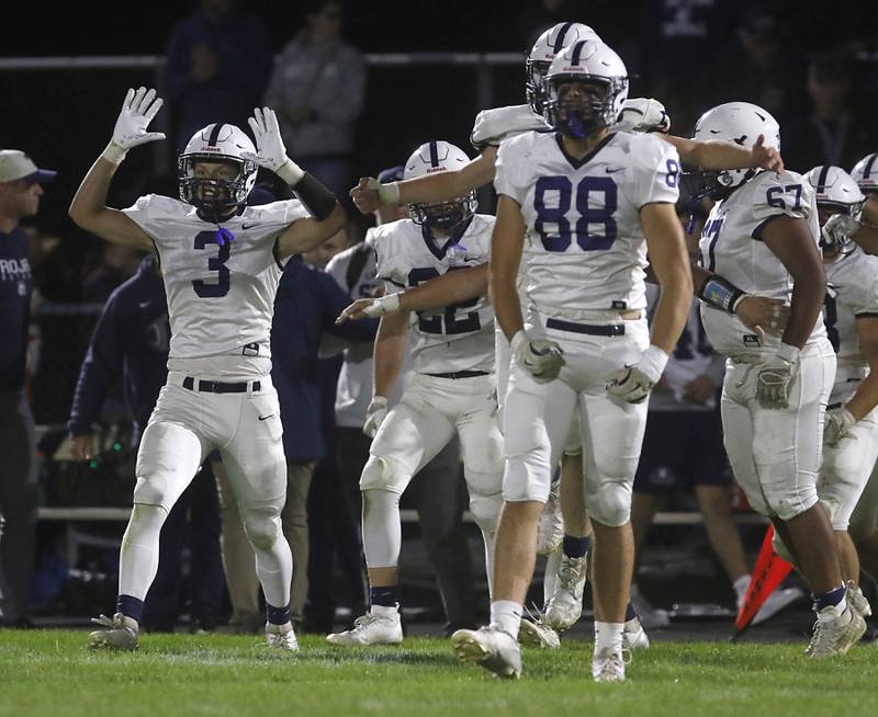 Cary-Grove's Preston Walsh celebrates with his teammates after they defeated Prairie Ridge in a Fox Valley Conference football game on Friday, Sept. 27, 2024, at Prairie Ridge High School.