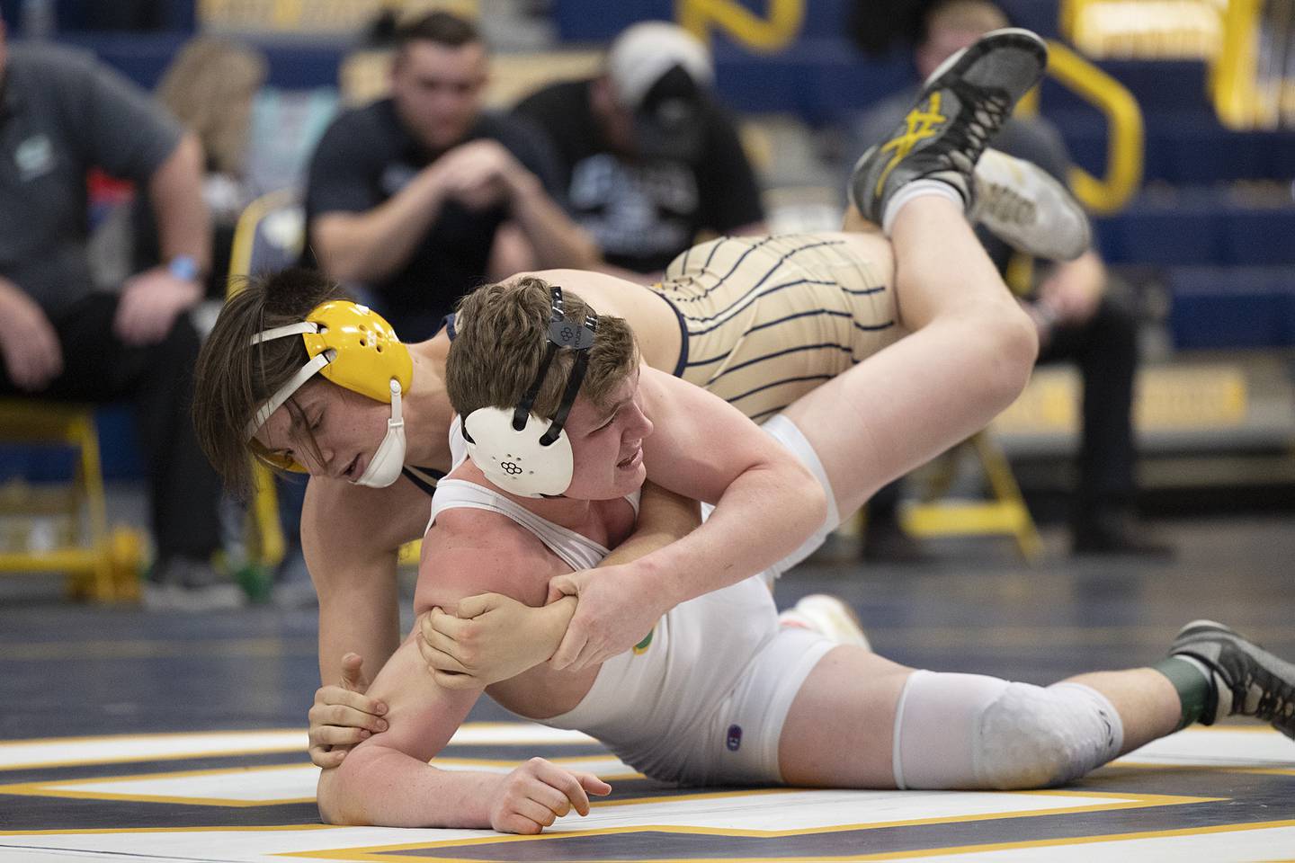 Sterling’s Gage Tate works Geneseo’s Logan Palmer in the 170 pound third place match at the Sterling wrestling regional. Tate won by pin.