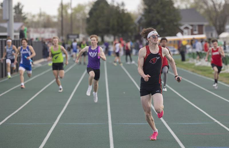 Forreston’s Michael Taylor leads the pack over the finish line in the 4x100 Friday, April 21, 2023 at the Rock Falls Rocket Invitational.