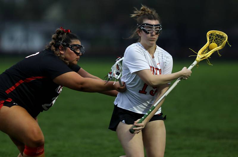 Huntley's Payton Turk guards Crystal Lake Central co-op's Layla Schnell during a Fox Valley Conference girls lacrosse match on Friday, April 17, 2026, at Crystal Lake Central High School.
