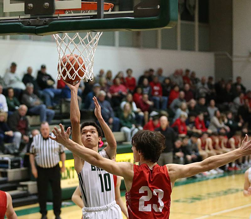 St. Bede's Isiah Hart (left) shoots a shot over Hall's Braden Curran (right) on Monday, Dec. 14, 2022 at St. Bede Academy.