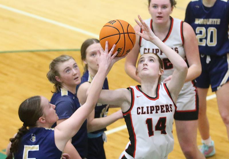 Amboy/Ohio's Jillian Anderson lets go of a shot as Marquette's Chloe Larson defends during the Class 1A Regional championship on Thursday, Feb. 20, 2025 at St. Bede Academy.