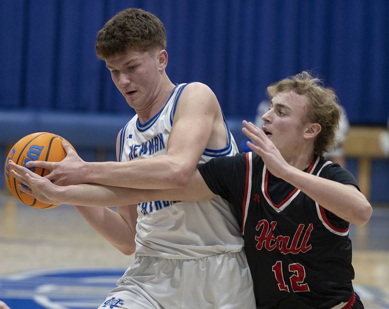 Newman’s John Rowzee and Hall’s Hunter Edgcomb battle for the ball Tuesday, Feb. 17, 2026.