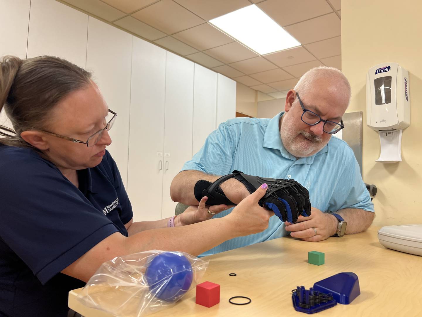 Occupational Therapist Beth Bosak helps Dan Davis exercise his arm and hand during an occupational therapy session at Northwestern Medicine Marianjoy Rehabilitation Hospital.