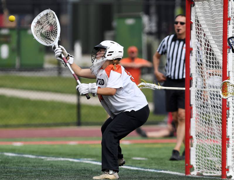 Crystal Lake Central Coop goalie Anya Korczak makes a save the third-place game of the girls lacrosse state finals at Hinsdale Central High School on Saturday, June 7, 2025.