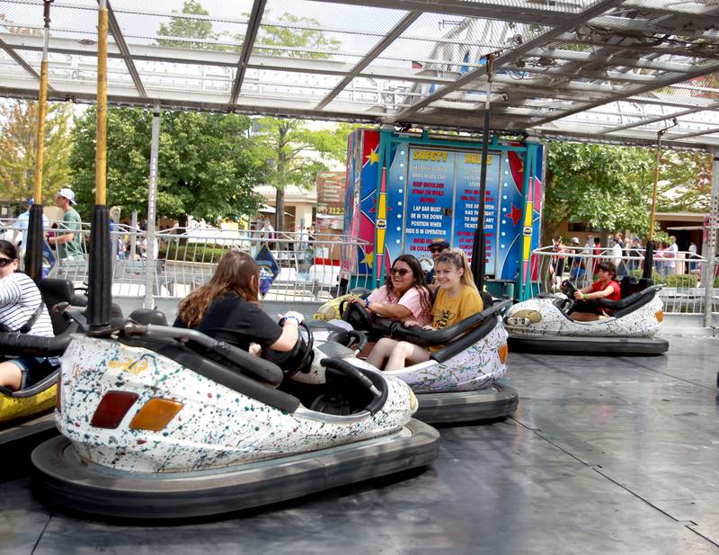 Patrons ride the bumper cars during the 155th Kane County Fair in St. Charles on Sunday, July 21, 2024.