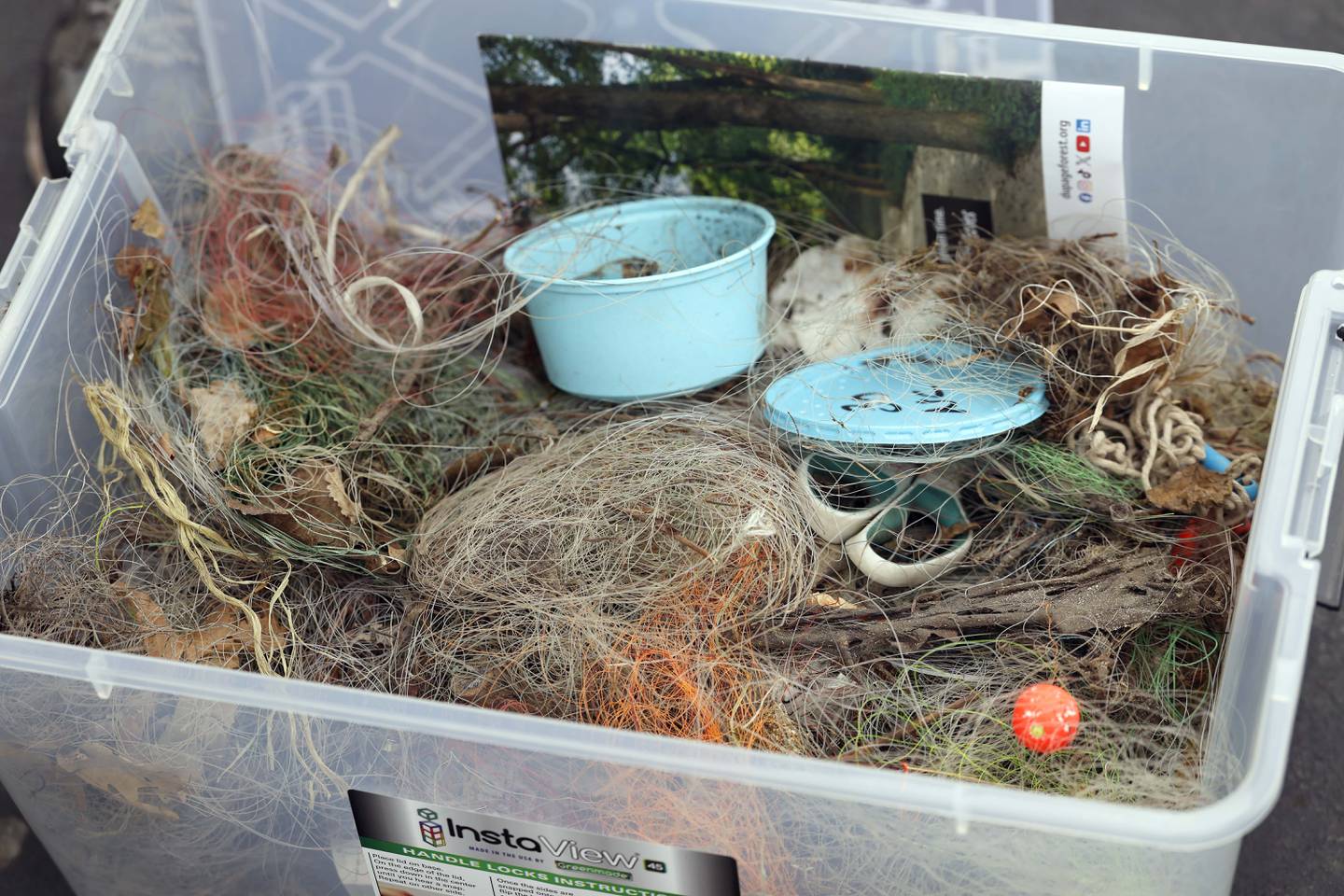 This bin contains discarded fishing line as well as hooks that Amy Tavolino of Wheaton and her husband, Jerry, collected in summer 2025 at area forest preserves.