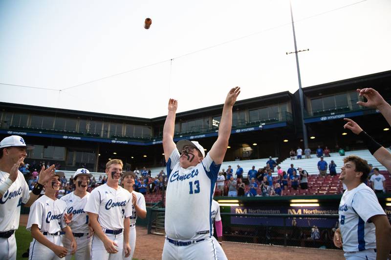 Newman Central Catholic’s Cooper Spears throws a Monster Energy Drink after chugging it to celebrate a win against Hope Academy at Northwestern Medicine Field in Geneva on Monday, June 2, 2025.