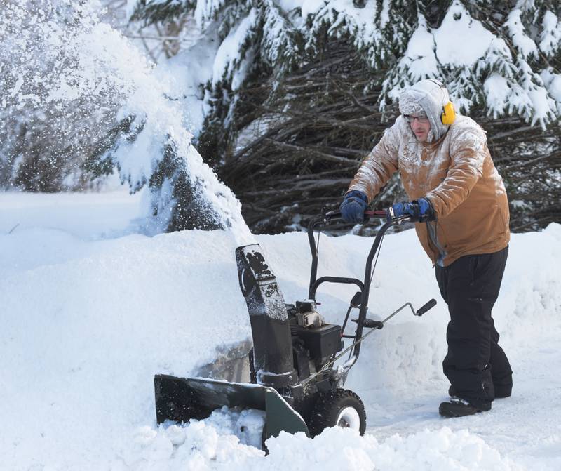 Steven Garbielson of Mt. Morris blows snow from his driveway on Saturday, Jan. 13, 2024. Friday's winter storm dumped 10-12 inches of snow on the village and left residents still digging out over the weekend.