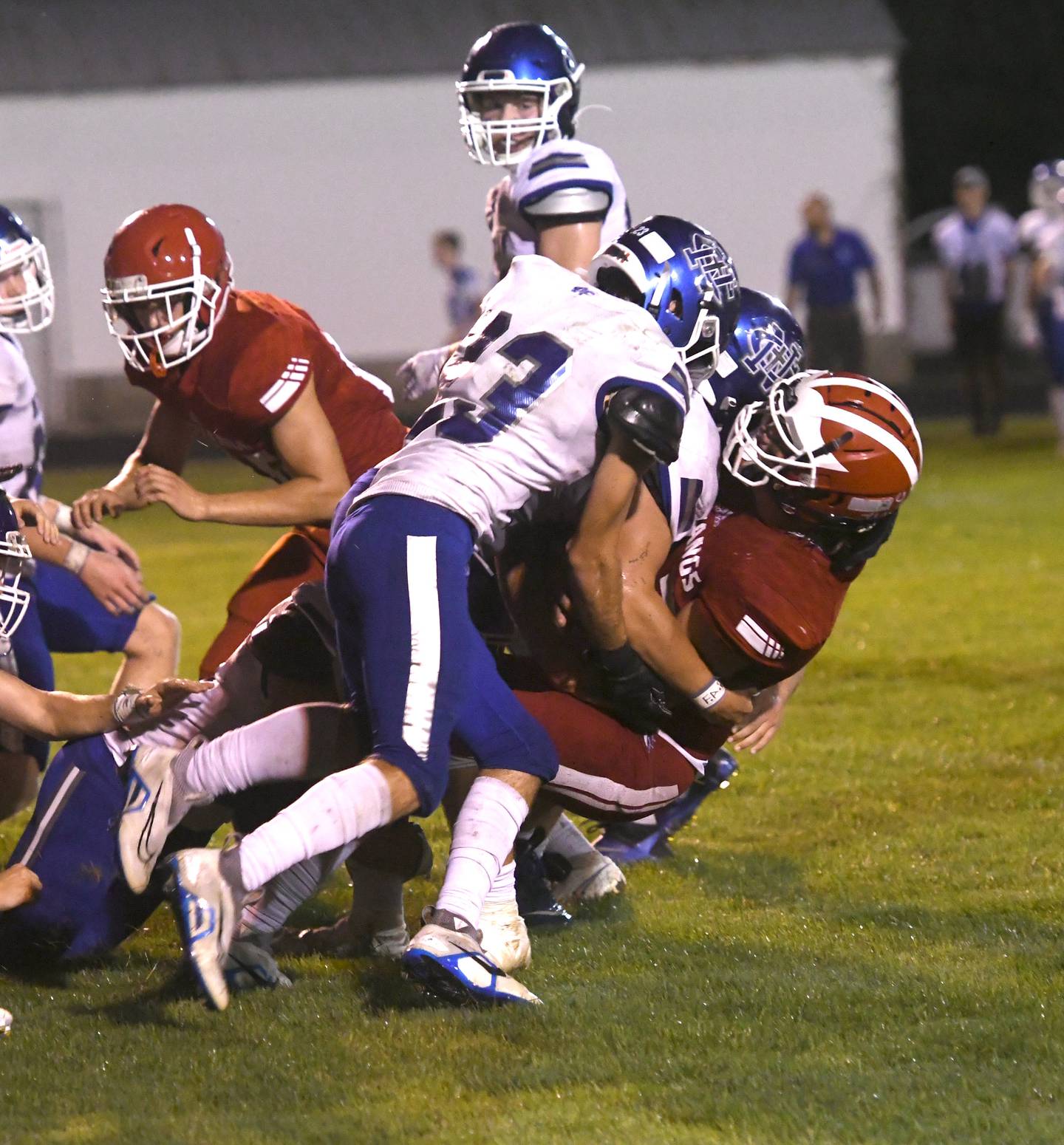 Newman defenders drive back a Morrison ball carrier during Friday, Aug. 26, 2022 action.