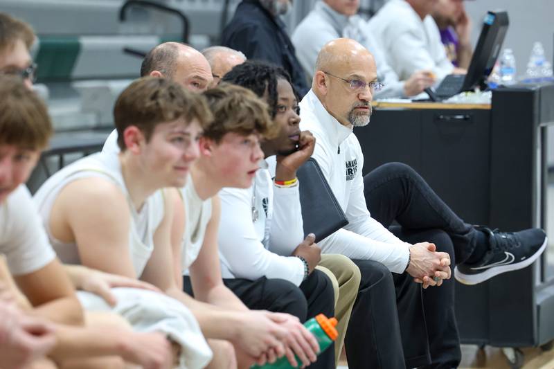Bishop McNamara head coach Adrian Provost watches the game during the Fightin' Irish's 62-25 victory over Chesterton Academy on Wednesday, Jan. 7, 2026.