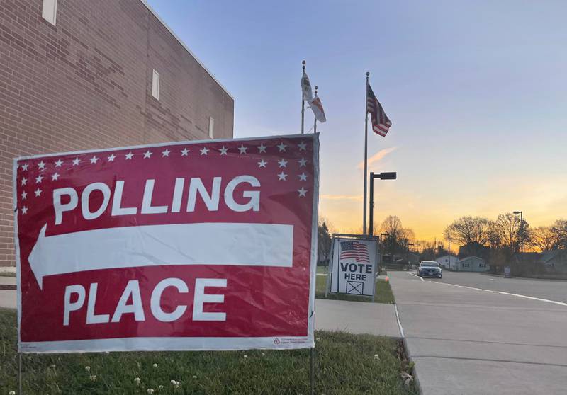 The sun rises over the polling place at Hall High School on Tuesday, Nov. 8, 2022 in Spring Valley.