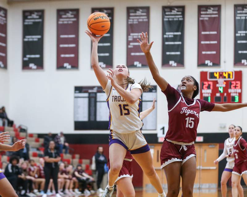 Downers Grove North's Adysen Fanta (15) puts up a challenged shot during their Regional Final basketball game between Downers Grove North at Plainfield North. Feb 20, 2025 in Plainfield.