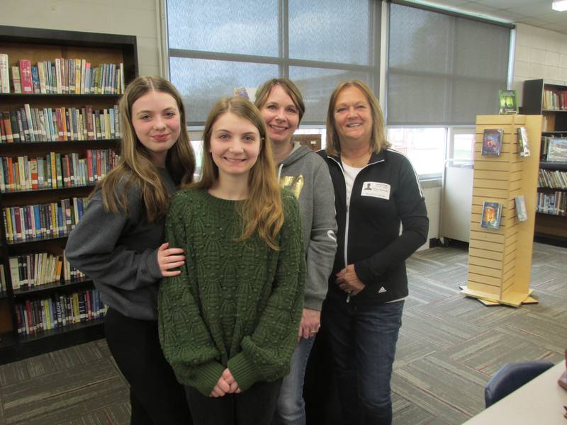 Shay Wilcoxen (second from left) is joined by her sister Layna Wilcoxen, mother Kerri Wilcoxen and grandmother Karen Bottoms on Tuesday, April 25, 2023, as the Streator Leading Ladies awarded her with the first Beckie Chismarick Community Service Award during a regular Woodland Key Club meeting in the school's library.