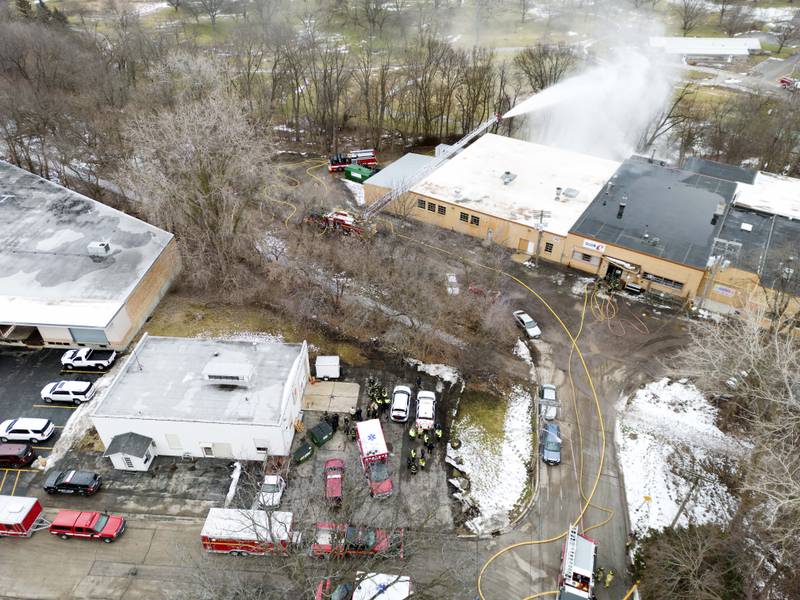 Area crews work to control a fire and hazmat response in the 400 block of Union Street Tuesday February 7, 2023 in Geneva.