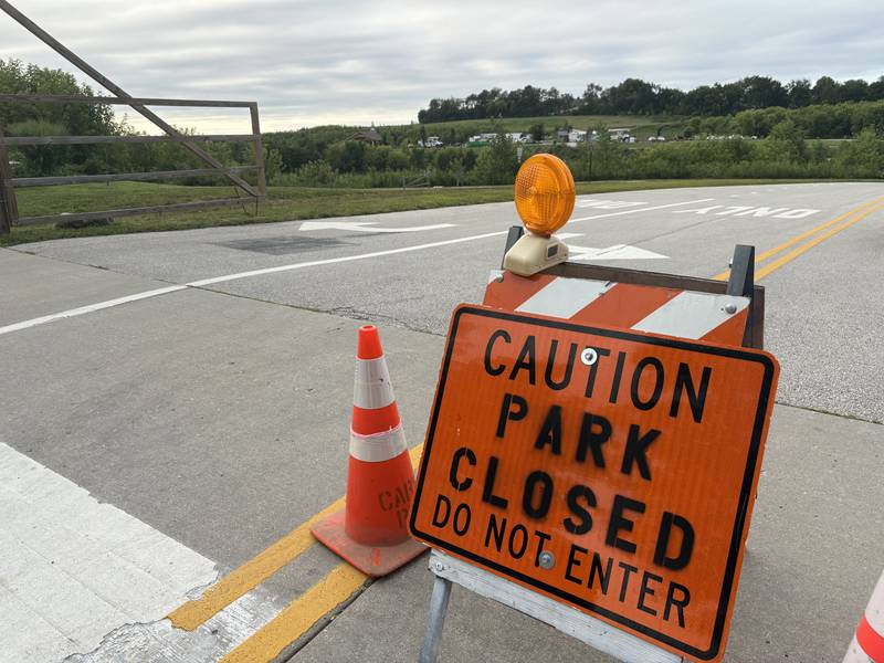 A sign at the entrance to Cary Lake at Rotary Park in Cary says the park is closed Aug. 17, 2025.