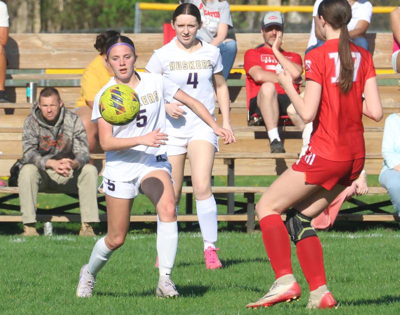 Serena/Newark/Earlville's Kiera McNelis looks to knock down the ball as teammate Olivia Callier glances on while Streator's Jordan Hatzer eyes the ball on Thursday, April 16, 2026 at the James Street Recreational Complex in Streator.