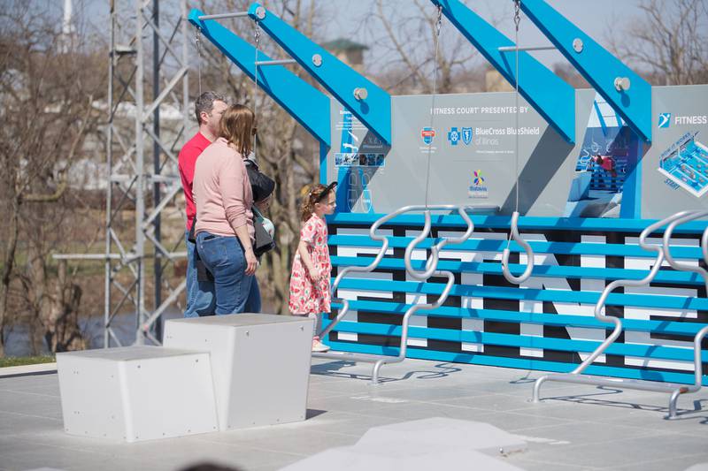 Families check out the fitness court at Clark Island Recreation area on Saturday, April 12, 2025 in Batavia.