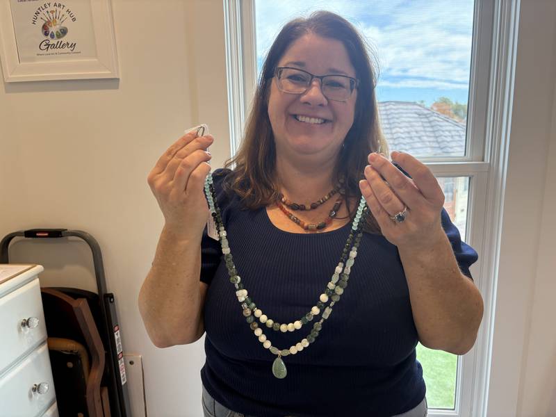 Cindy Rafkind shows off a necklace she made Oct. 28, 2025 at Huntley Art Hub Gallery.