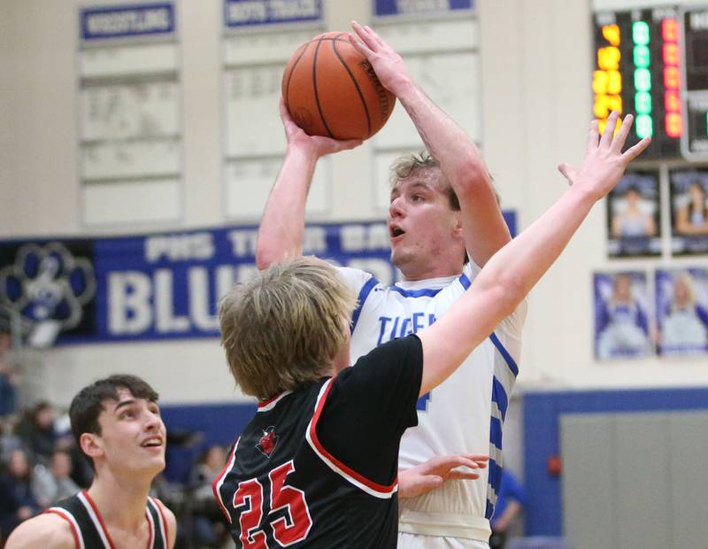 Princeton's Korte Lawson shoots a jump shot over Hall's Wyatt West on Friday, Jan. 26, 2024 at Princeton High School.