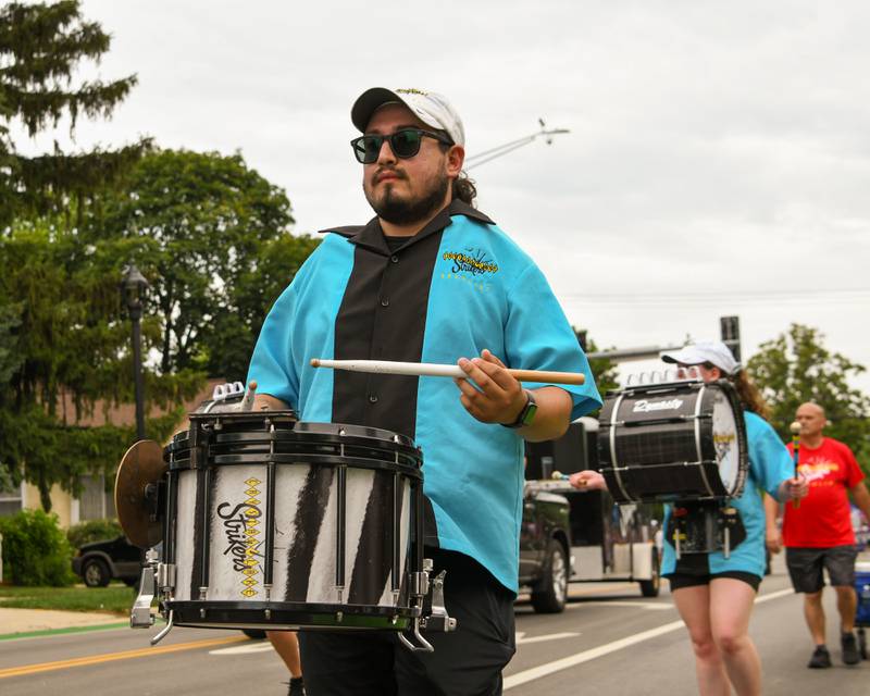 Crystal Lake Strikers drum their way down the parade route on Friday July 4, 2025, during the Independence Day parade in downtown Downers Grove.