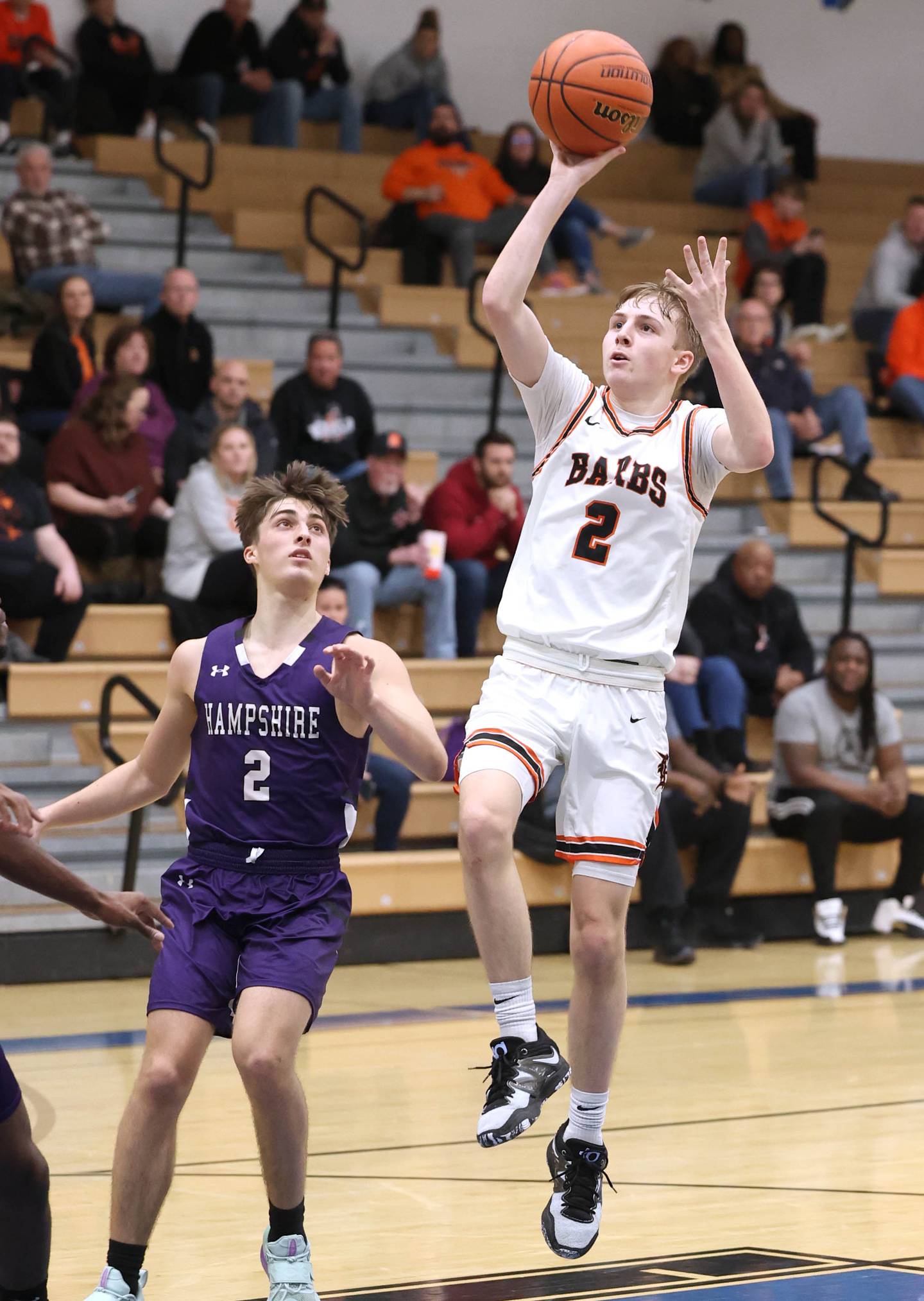 DeKalb's Sean Reynolds gets a shot up in front of Hampshire's Joey Costabile Friday, Feb. 24, 2023, during the Class 4A regional championship game at St. Charles North High School.