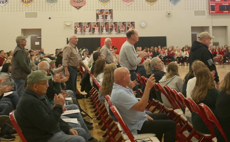 Veterans stand to be recognized during the annual Veterans Day Program on Monday, Nov. 11, 2024 at Parkside Middle School in Peru.