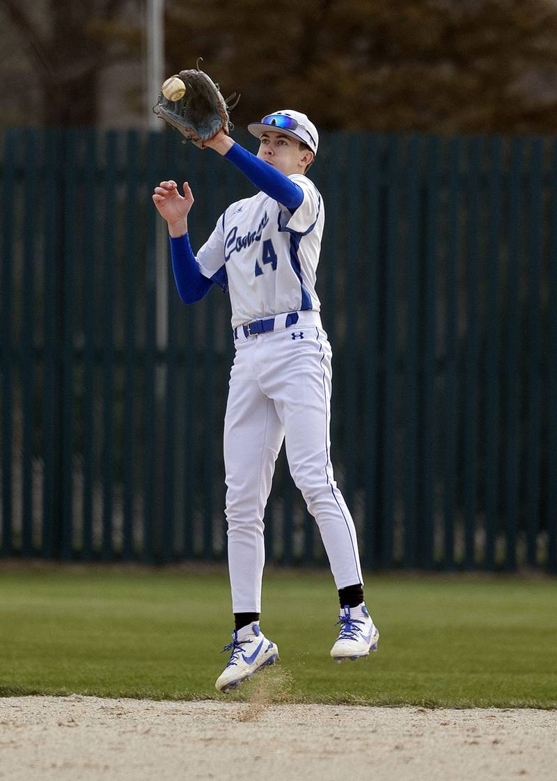 Newman’s Jameson Hanlon leaps to field a grounder for the final out and a win over Princeton Thursday, April 10, 2025.