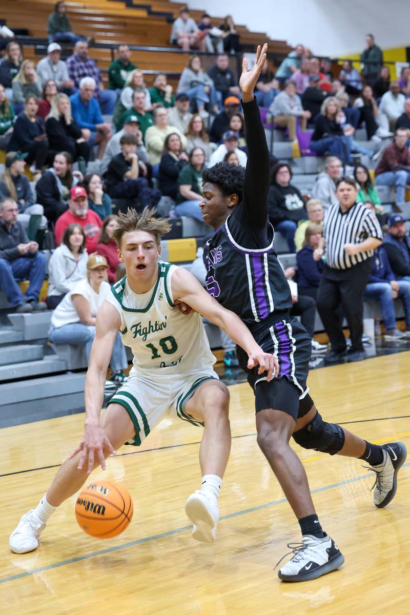 Bishop McNamara's Coen Demack drives to the lane during the Fightin' Irish's 66-52 victory over El Paso-Gridley in the IHSA Class 2A Herscher Regional championship on Friday, Feb. 27, 2026.