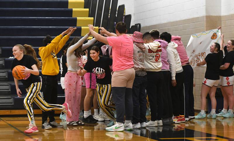 The Lady Marcos run through a tunnel of made by fans at the start of their "Pink Night" game with Milledgeville on Saturday, Jan. 24, 2026 at Polo High School. Proceeds from the "Hoops for Hope" cancer awareness game benefit the CGH Health Foundation to support no-cost mammograms.