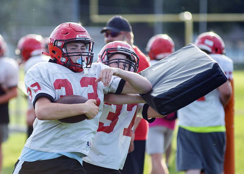 Amboy players run through drills Thursday, July 28, 2022 at the high school. First day of IHSA football practice is just over a week away for local teams.