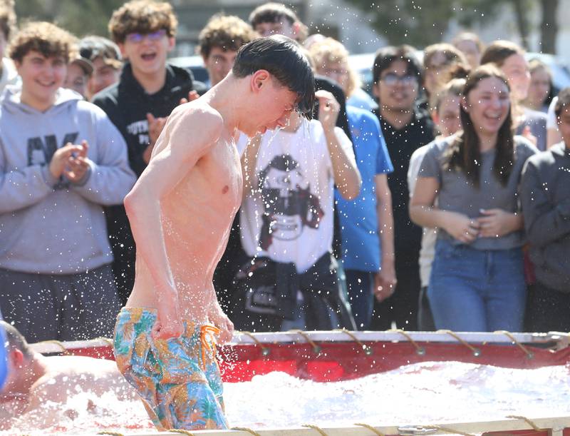 Putnam County High School student Beckham Baker, reacts to cold water while jumping in a water tank during the Polar Plunge to support Special Olympics on Friday, March 14, 2025 at Putnam County High School.
