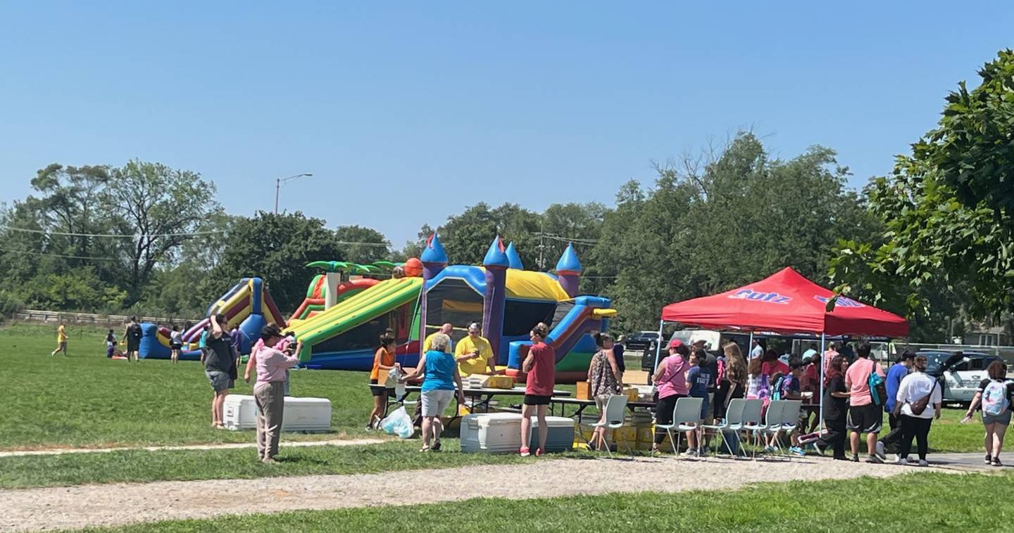 Families came out in heat indices nearing 100 degrees to attend the Joliet Park District's back-to-school event at Nowell Park. on Saturday, Aug. 9, 2025.  The annual event gives out school supplies to local students ahead of the new school year.