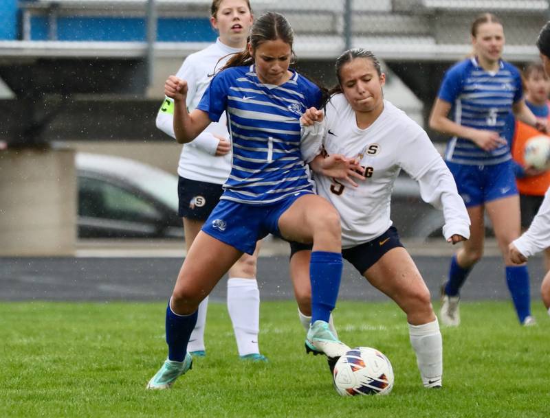 Princeton's Olivia Sandoval and Sterling's Tatiana Ibarra (5) battle for the ball Thursday at Bryant Field. The Tigresses won 3-1.